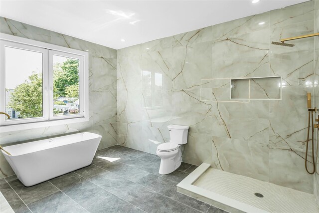 9 Vista Ln, Levittown, NY 11756 - bathroom featuring tile walls, a marble finish shower, marble finish floors, a freestanding bath, and toilet