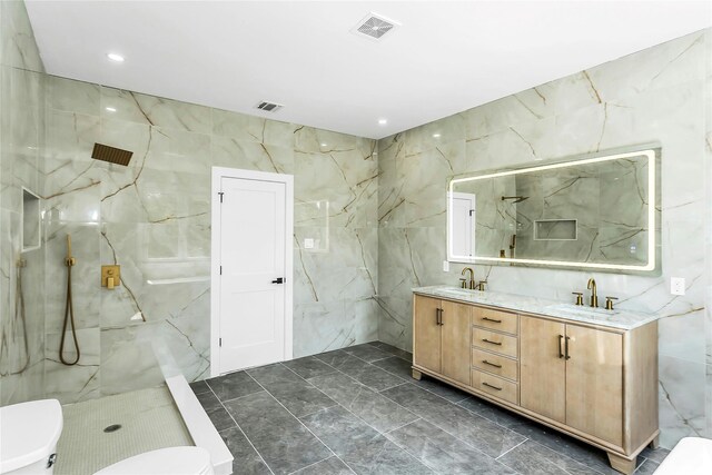 9 Vista Ln, Levittown, NY 11756 - full bathroom featuring tile walls, toilet, a marble finish shower, double vanity, and marble finish floors