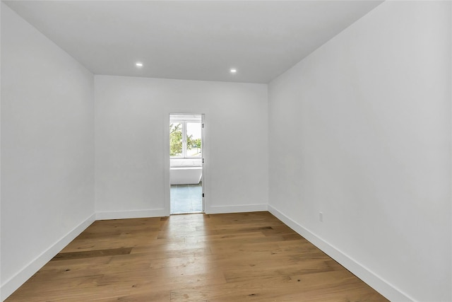 9 Vista Ln, Levittown, NY 11756 - empty room with baseboards, recessed lighting, and light wood-type flooring