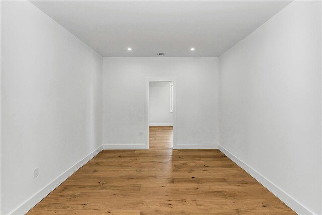 9 Vista Ln, Levittown, NY 11756 - unfurnished room featuring recessed lighting, baseboards, and light wood-type flooring
