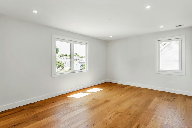 9 Vista Ln, Levittown, NY 11756 - empty room featuring baseboards, light wood-type flooring, and recessed lighting