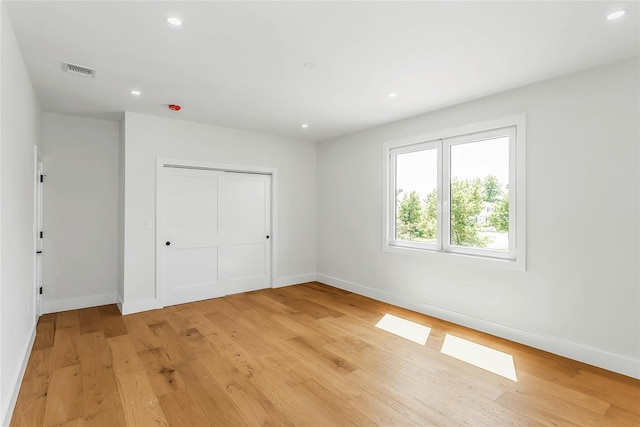 9 Vista Ln, Levittown, NY 11756 - unfurnished bedroom featuring baseboards, light wood finished floors, recessed lighting, and a closet