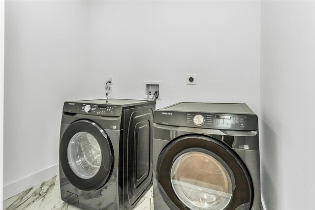 9 Vista Ln, Levittown, NY 11756 - washroom with light marble finish floors, washer and dryer, and baseboards