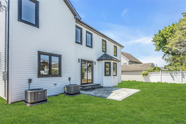 9 Vista Ln, Levittown, NY 11756 - back of property featuring cooling unit and a patio area
