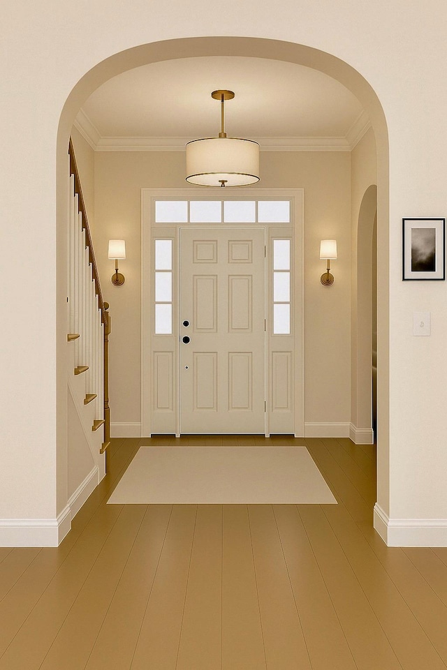 8 Newburgh Rd, Patterson, NY 12563 - entrance foyer with arched walkways, baseboards, crown molding, stairs, and wood finished floors