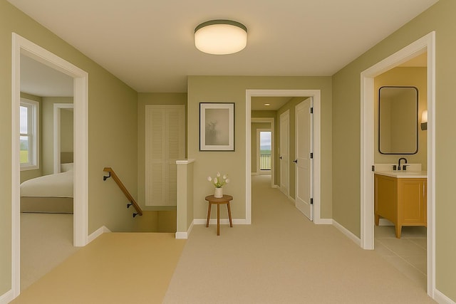 8 Newburgh Rd, Patterson, NY 12563 - hall featuring an upstairs landing, light carpet, baseboards, and a sink