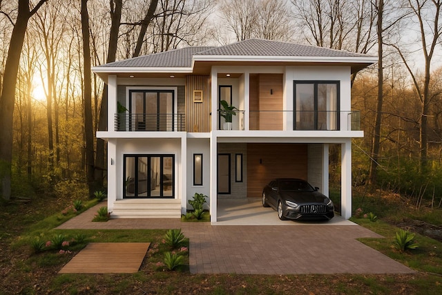 8 Newburgh Rd, Patterson, NY 12563 - back of house featuring a balcony, a carport, and stucco siding
