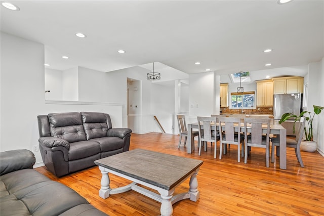 402 Chelsea Ave, West Babylon, NY 11704 - living room with light wood-style flooring and recessed lighting