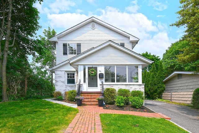 46 Gilbert St, Northport, NY 11768 - view of front of house featuring a front lawn