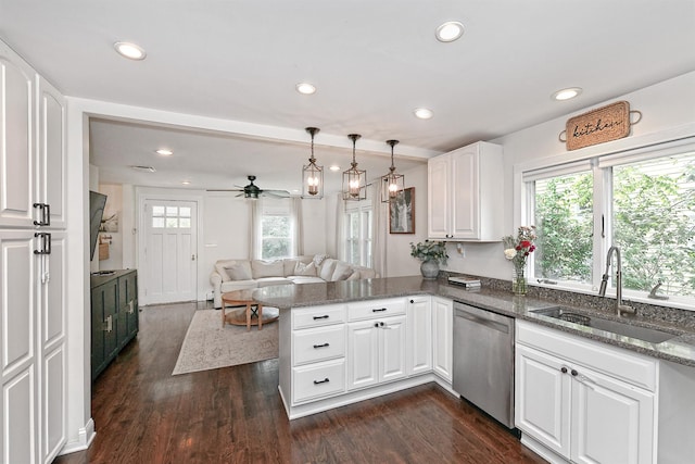 46 Gilbert St, Northport, NY 11768 - kitchen with stainless steel dishwasher, a sink, a peninsula, recessed lighting, and open floor plan