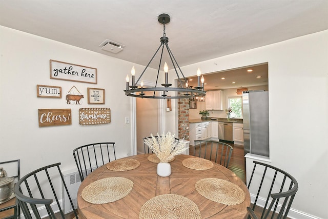 46 Gilbert St, Northport, NY 11768 - dining space with a chandelier, dark wood finished floors, and recessed lighting
