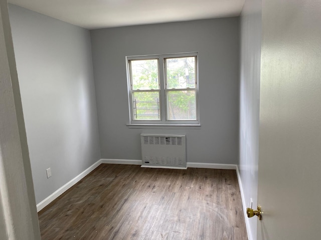 644 Autumn Ave, Brooklyn, NY 11208 - spare room with radiator and wood finished floors