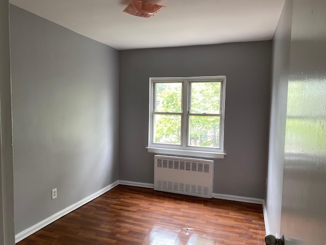 644 Autumn Ave, Brooklyn, NY 11208 - unfurnished room featuring radiator and wood finished floors
