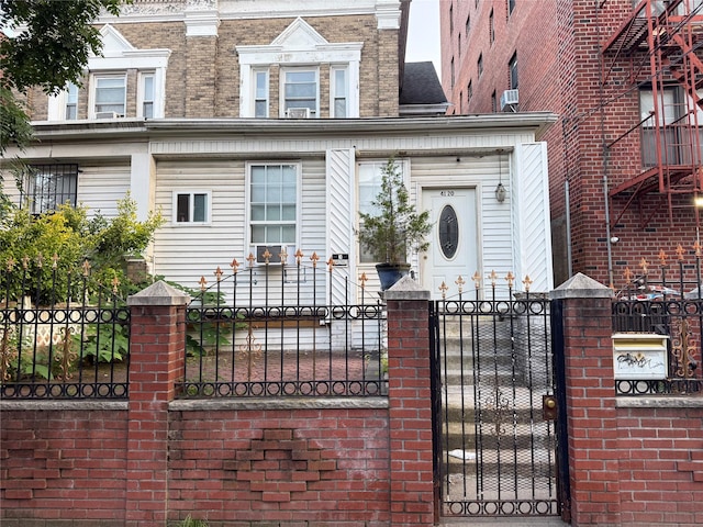 41-20 Elbertson St, Elmhurst, NY 11373 - view of front of home featuring a fenced front yard and a gate