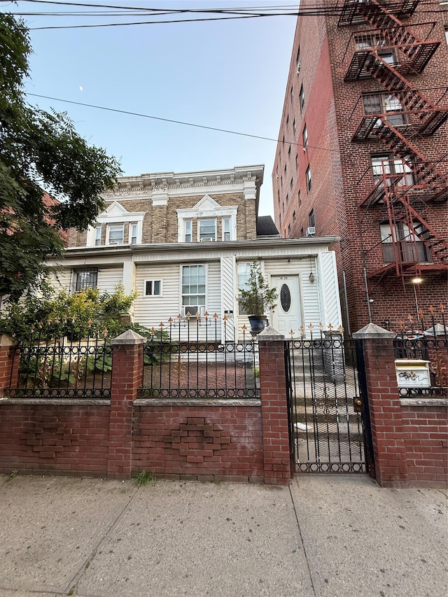41-20 Elbertson St, Elmhurst, NY 11373 - view of front of house with a fenced front yard and a gate