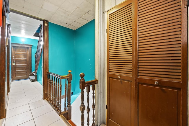 41-20 Elbertson St, Elmhurst, NY 11373 - hallway with tile patterned flooring and an upstairs landing