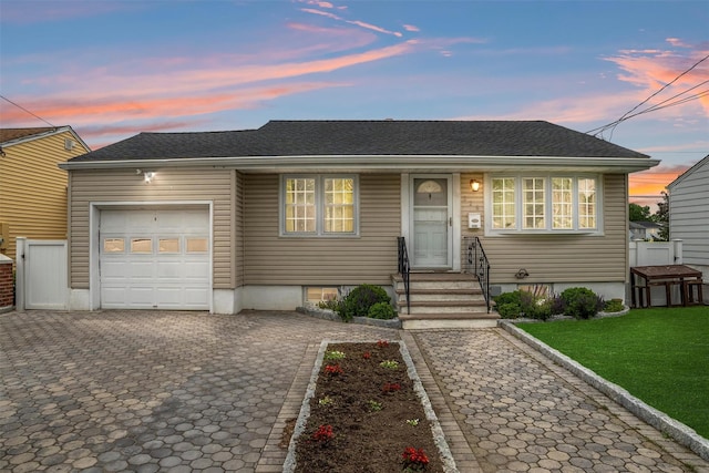 226 Mile Square Rd, Yonkers, NY 10701 - view of front of house with a garage, decorative driveway, a yard, entry steps, and roof with shingles