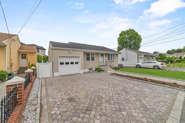 226 Mile Square Rd, Yonkers, NY 10701 - view of front facade featuring a garage and decorative driveway