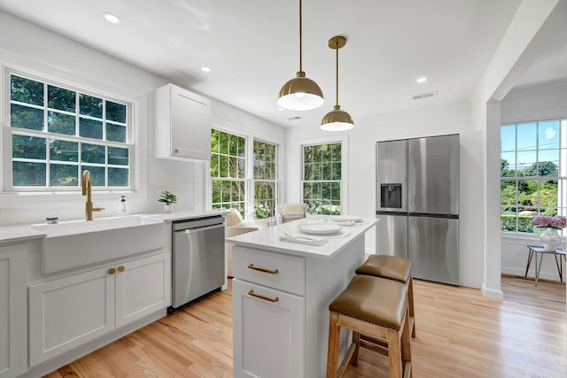 2850 Reeve Rd, Mattituck, NY 11952 - kitchen featuring stainless steel appliances, plenty of natural light, light wood finished floors, and recessed lighting