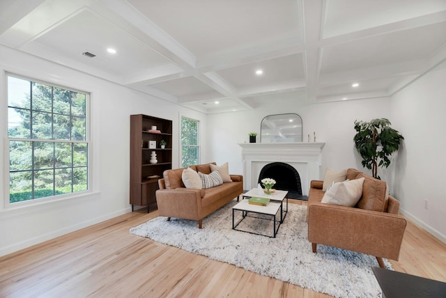 2850 Reeve Rd, Mattituck, NY 11952 - living area featuring wood finished floors, coffered ceiling, healthy amount of natural light, a fireplace, and beamed ceiling