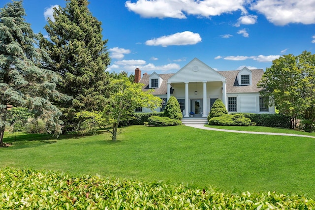 2850 Reeve Rd, Mattituck, NY 11952 - greek revival inspired property featuring a front lawn, a chimney, and roof with shingles