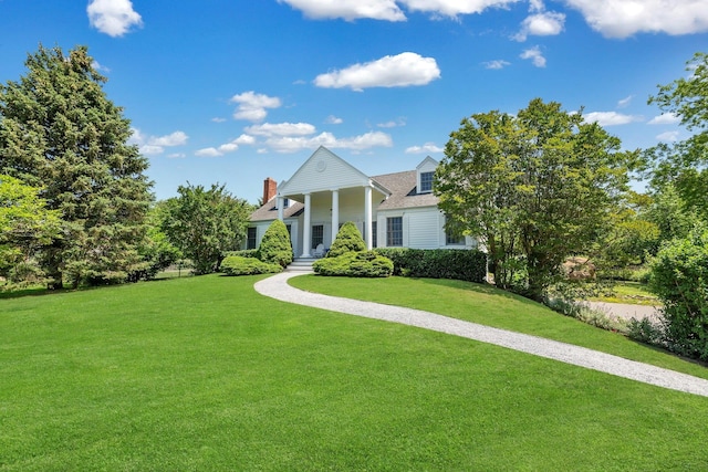 2850 Reeve Rd, Mattituck, NY 11952 - greek revival house featuring a front lawn
