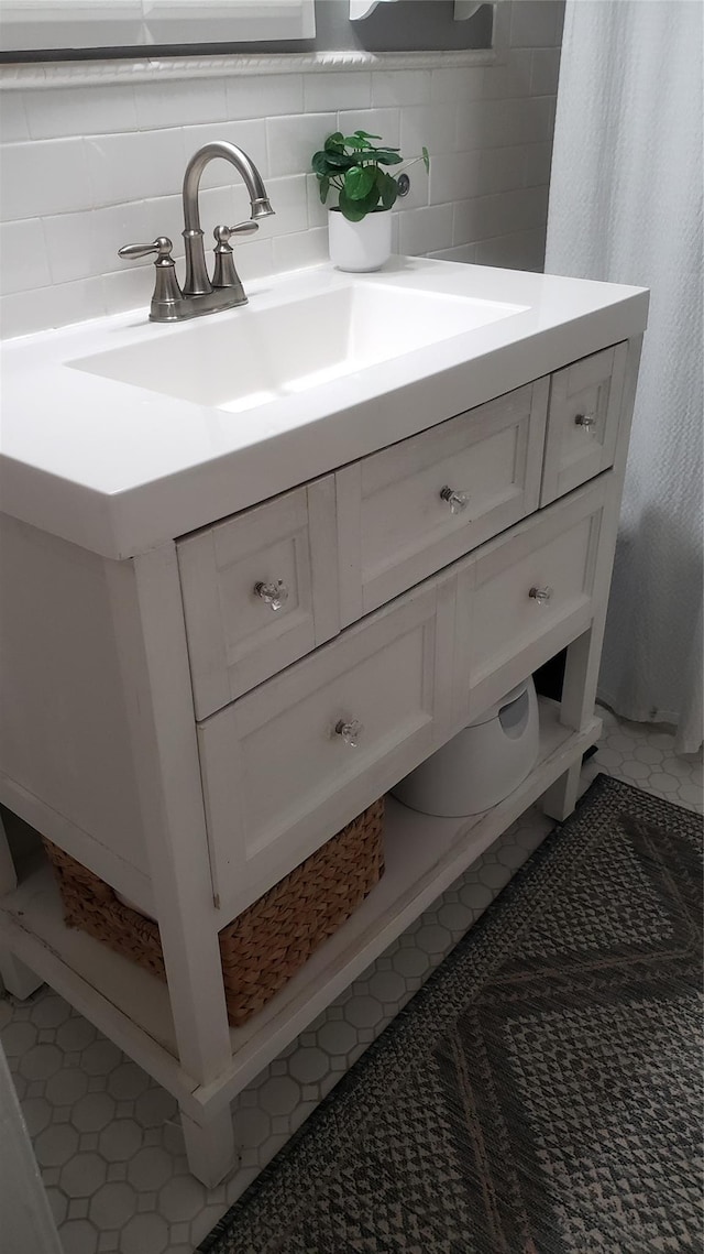1026 Logan Ave, Bronx, NY 10465 - bathroom with vanity and tasteful backsplash