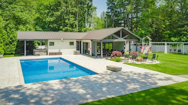 21 Dale Rd, Monsey, NY 10952 - outdoor pool with a covered hot tub, a patio, a playground, and an outdoor fire pit