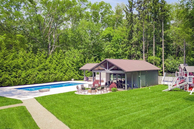 21 Dale Rd, Monsey, NY 10952 - swimming pool with a patio, a lawn, an outbuilding, and a wooded view