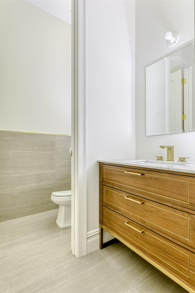 21 Dale Rd, Monsey, NY 10952 - bathroom featuring vanity, toilet, and tile walls
