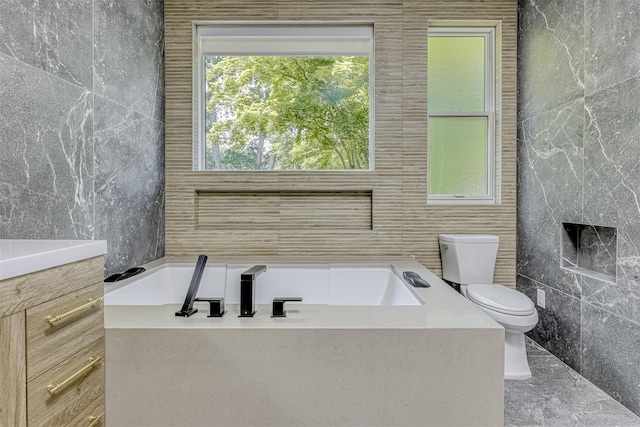 21 Dale Rd, Monsey, NY 10952 - bathroom with tile walls, toilet, and a bath