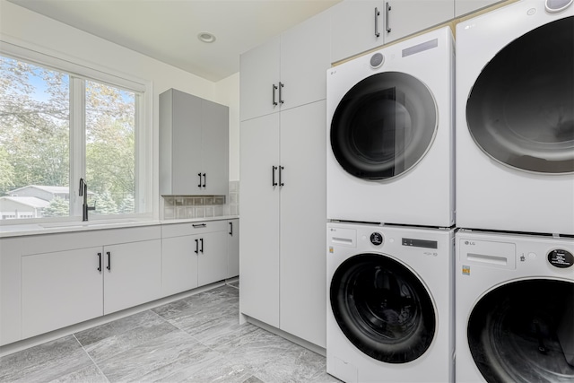 21 Dale Rd, Monsey, NY 10952 - laundry area featuring cabinet space, estacked washer and dryer, and washer and clothes dryer