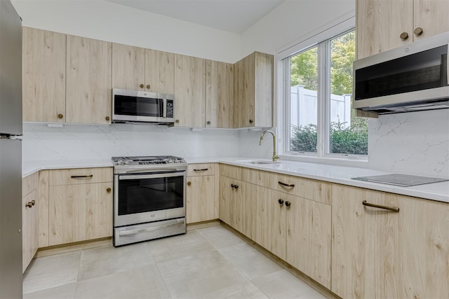 21 Dale Rd, Monsey, NY 10952 - kitchen featuring light brown cabinetry, stainless steel appliances, backsplash, and light countertops