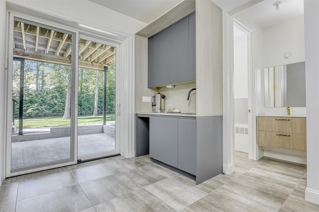 21 Dale Rd, Monsey, NY 10952 - bar area featuring light tile patterned floors and a sink