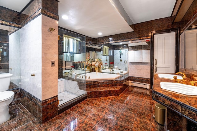 786 N Broadway, Yonkers, NY 10701 - full bathroom featuring toilet, tile walls, a baseboard radiator, a garden tub, and double vanity