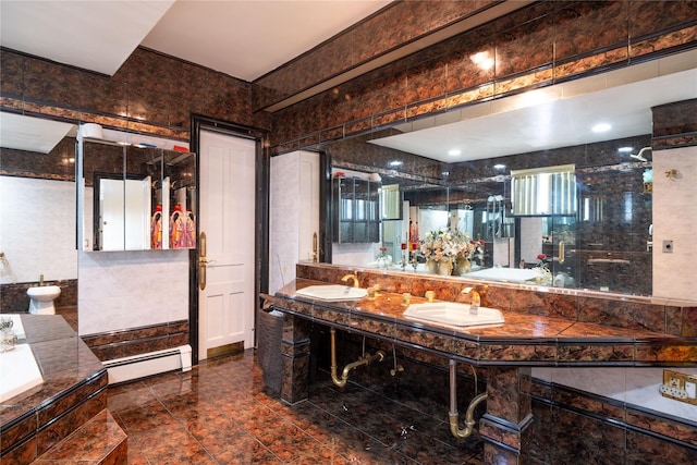 786 N Broadway, Yonkers, NY 10701 - bathroom with a baseboard radiator, a bidet, a tub, tile walls, and double vanity