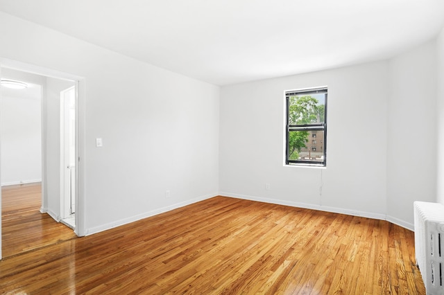 312 Main St Unit 4F, White Plains, NY 10601 - unfurnished room with radiator heating unit and light wood-type flooring