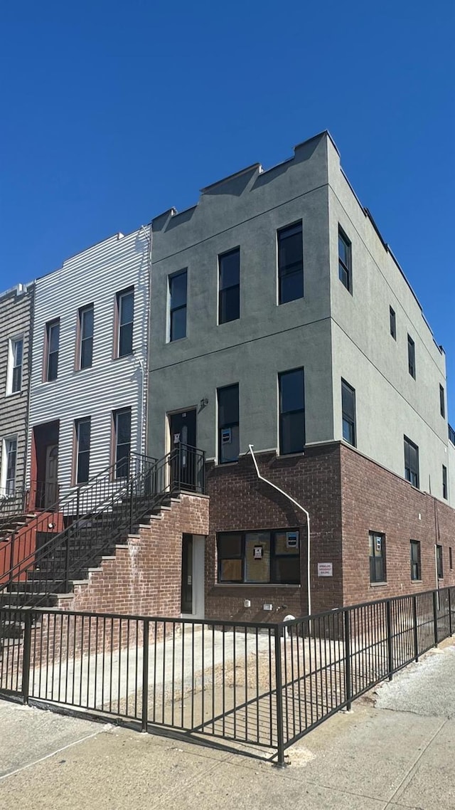 31 Roosevelt Pl, Brooklyn, NY 11233 - view of front of home featuring a fenced front yard