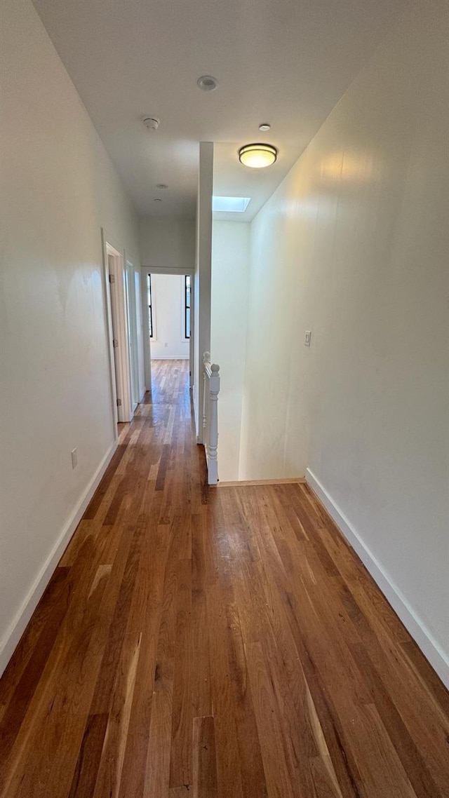 31 Roosevelt Pl, Brooklyn, NY 11233 - corridor with wood finished floors and an upstairs landing