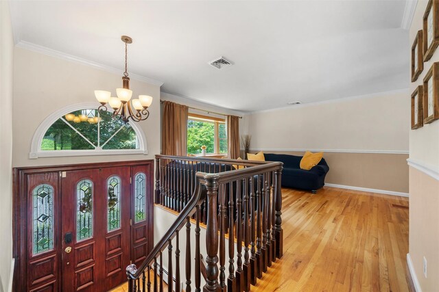 154 Meadow Lark Rd, Montgomery, NY 12549 - entrance foyer with a chandelier, light wood-type flooring, baseboards, and ornamental molding