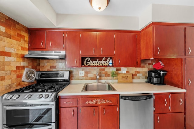 154 Meadow Lark Rd, Montgomery, NY 12549 - kitchen with stainless steel appliances, under cabinet range hood, a sink, light countertops, and decorative backsplash