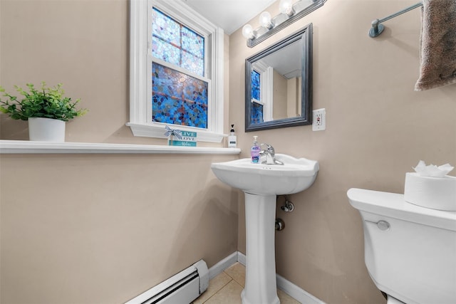 154 Meadow Lark Rd, Montgomery, NY 12549 - bathroom with toilet, a baseboard heating unit, tile patterned floors, baseboards, and a sink