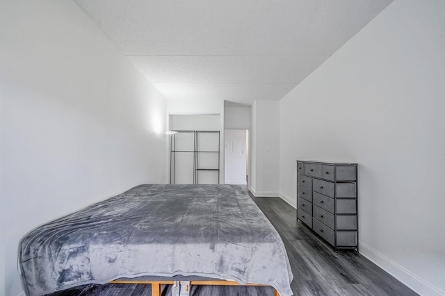 725 Miller Ave Unit 134, Freeport, NY 11520 - bedroom with dark wood-style floors and baseboards