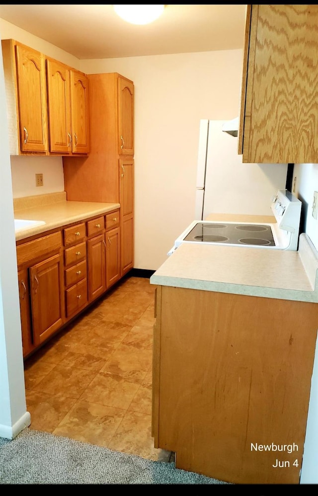 20 Pierces Rd Unit 61, Newburgh, NY 12550 - kitchen with white appliances, light countertops, and baseboards