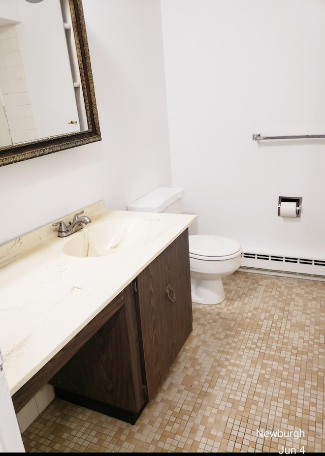 20 Pierces Rd Unit 61, Newburgh, NY 12550 - bathroom featuring baseboard heating, vanity, and toilet