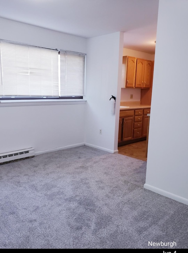 20 Pierces Rd Unit 61, Newburgh, NY 12550 - carpeted spare room with baseboards and a baseboard heating unit