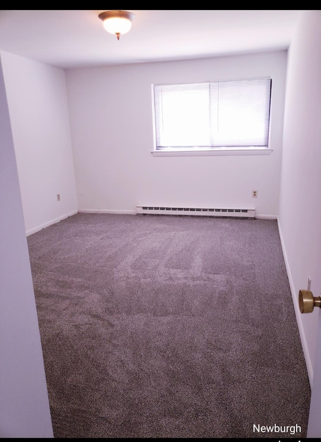 20 Pierces Rd Unit 61, Newburgh, NY 12550 - spare room featuring baseboard heating, carpet flooring, and baseboards