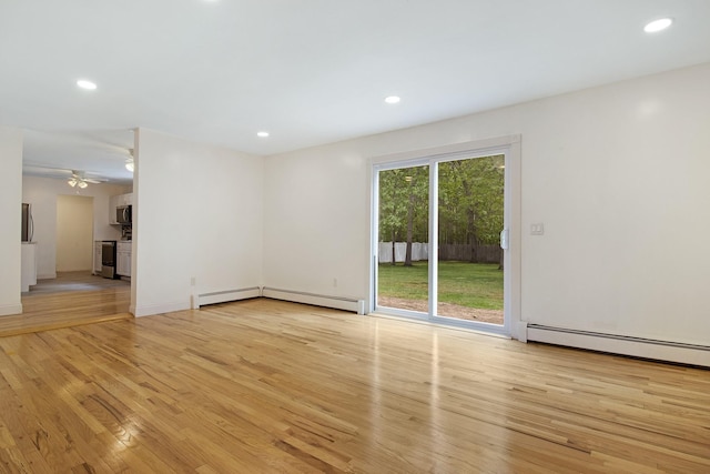 16 Sampson Ave, Islandia, NY 11749 - empty room with light wood-style flooring, recessed lighting, a ceiling fan, and a baseboard radiator
