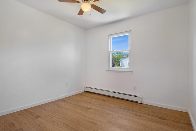 16 Sampson Ave, Islandia, NY 11749 - unfurnished room featuring a baseboard radiator, wood finished floors, and baseboards