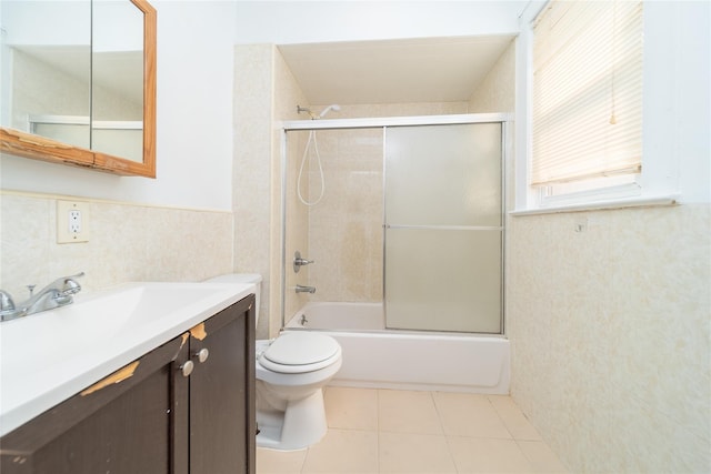 124-01 9th Ave, College Point, NY 11356 - full bath with toilet, vanity, shower / bath combination with glass door, tile patterned floors, and a wainscoted wall